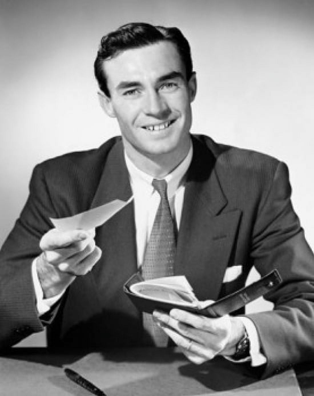 Posterazzi Portrait of a businessman holding a check and a checkbook Canvas Art - (24 x 36)