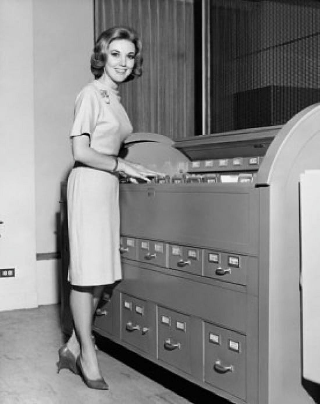 Posterazzi Portrait of a businesswoman standing beside a filing cabinet Canvas Art - (24 x 36)