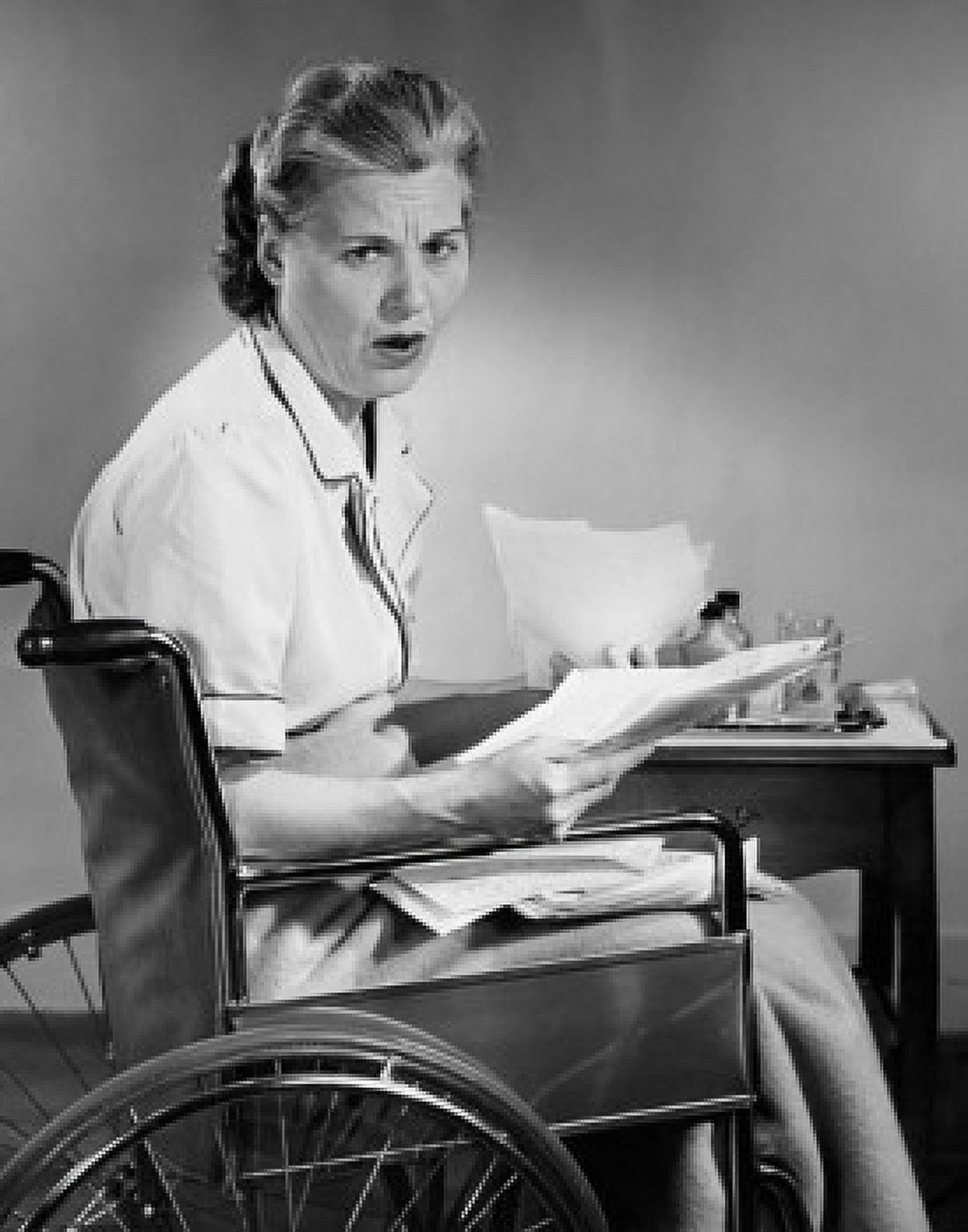 Posterazzi Portrait of a mature woman looking at bills while sitting on a wheelchair Canvas Art - (24 x 36)