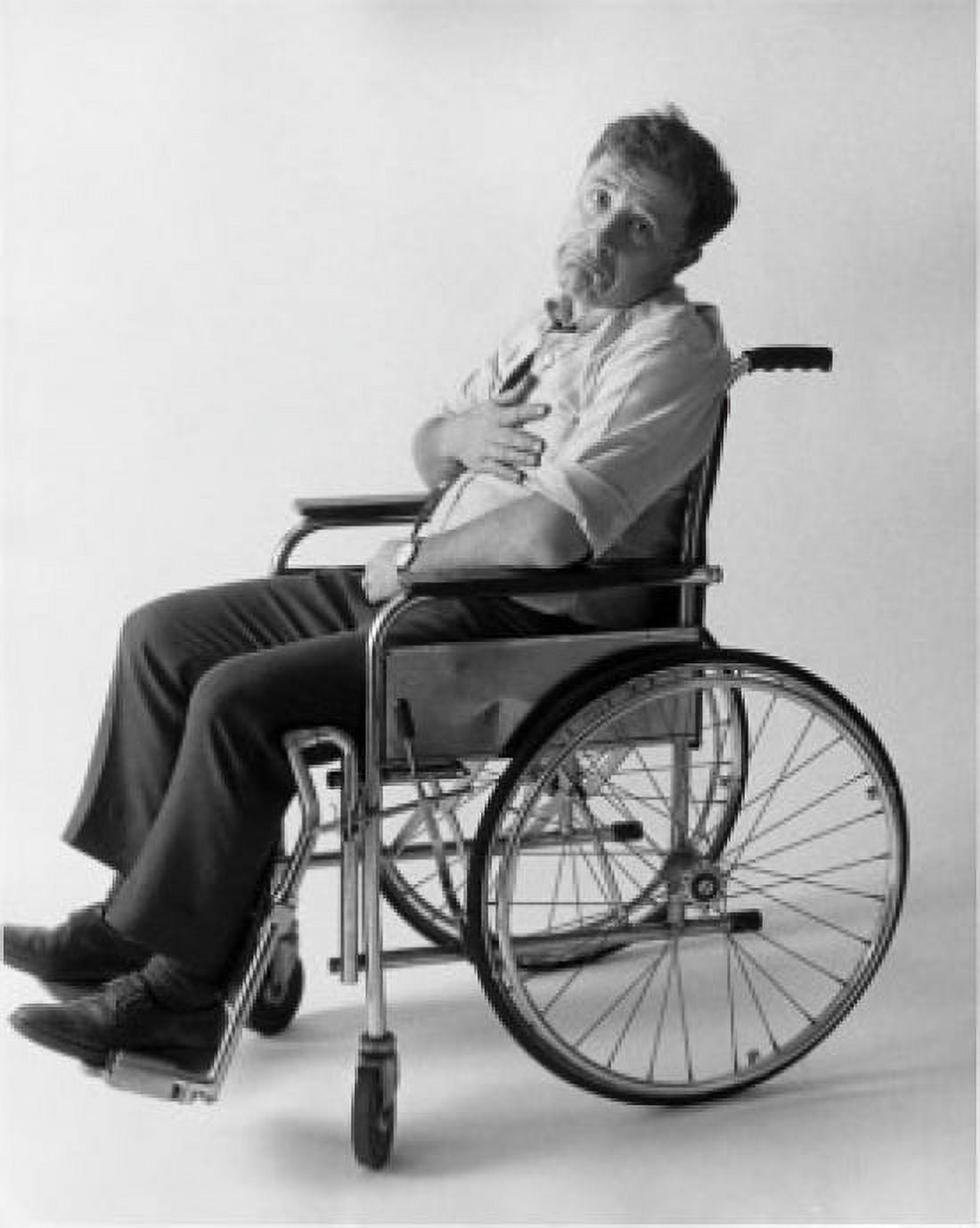 Posterazzi Portrait of a mid adult man sitting on a wheelchair Canvas Art - (24 x 36)