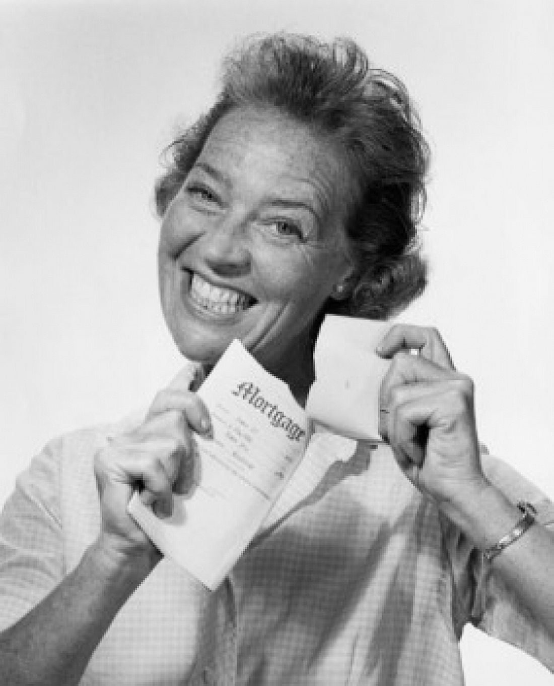 Posterazzi Portrait of a mid adult woman tearing a mortgage document Canvas Art - (24 x 36)