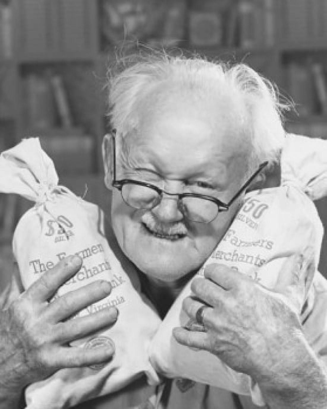 Posterazzi Portrait of a senior man holding two bags of money Canvas Art - (24 x 36)