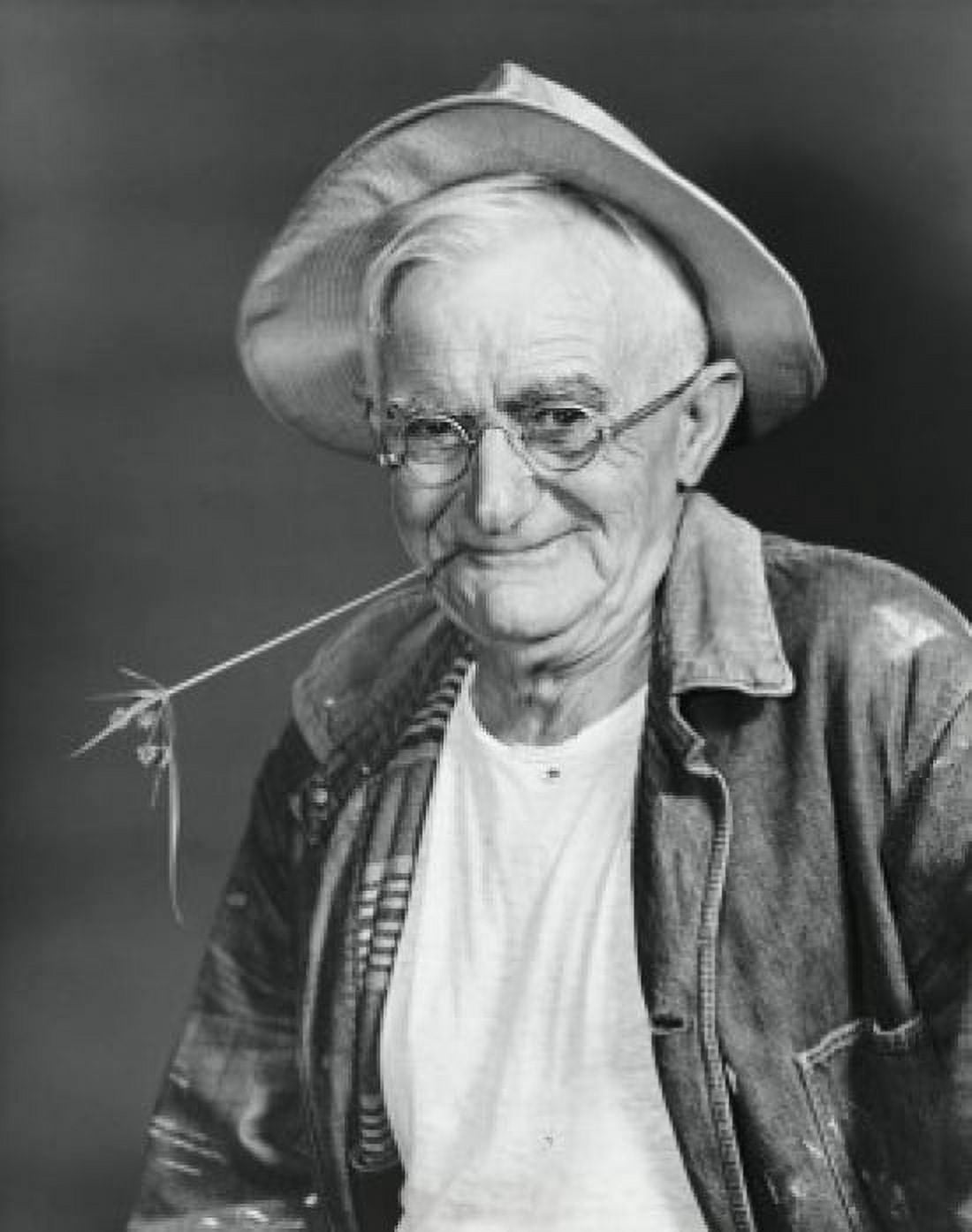Posterazzi Portrait of a senior man smiling with a twig in his mouth Canvas Art - (24 x 36)