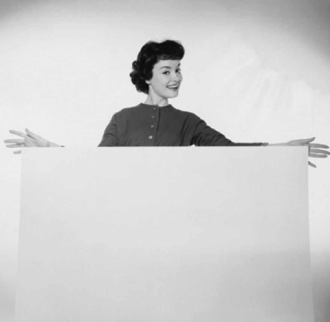 Posterazzi Portrait of a young woman holding a blank placard Canvas Art -  (24 x 36)