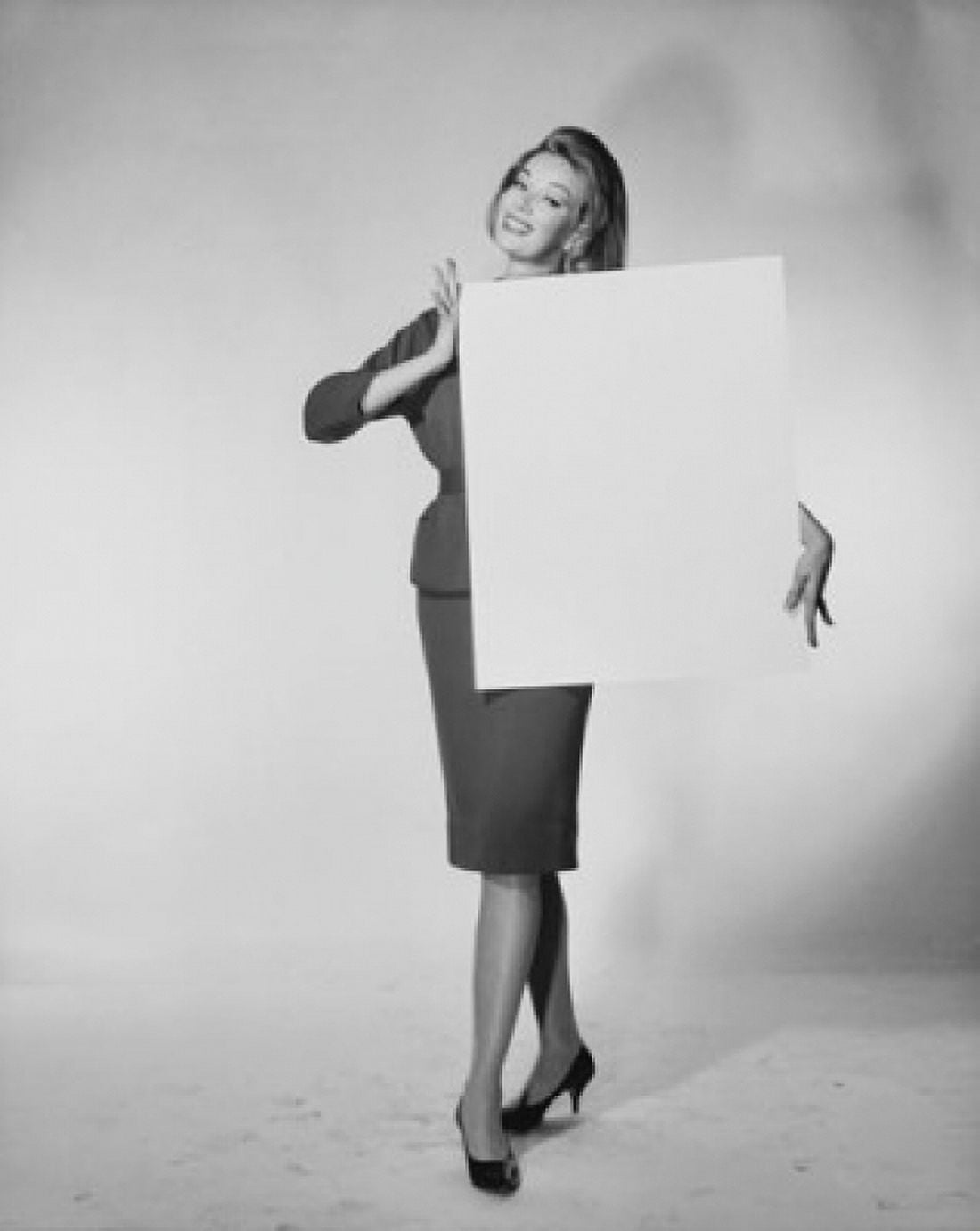 Posterazzi Portrait of a young woman holding a blank placard Canvas Art - (24 x 36)