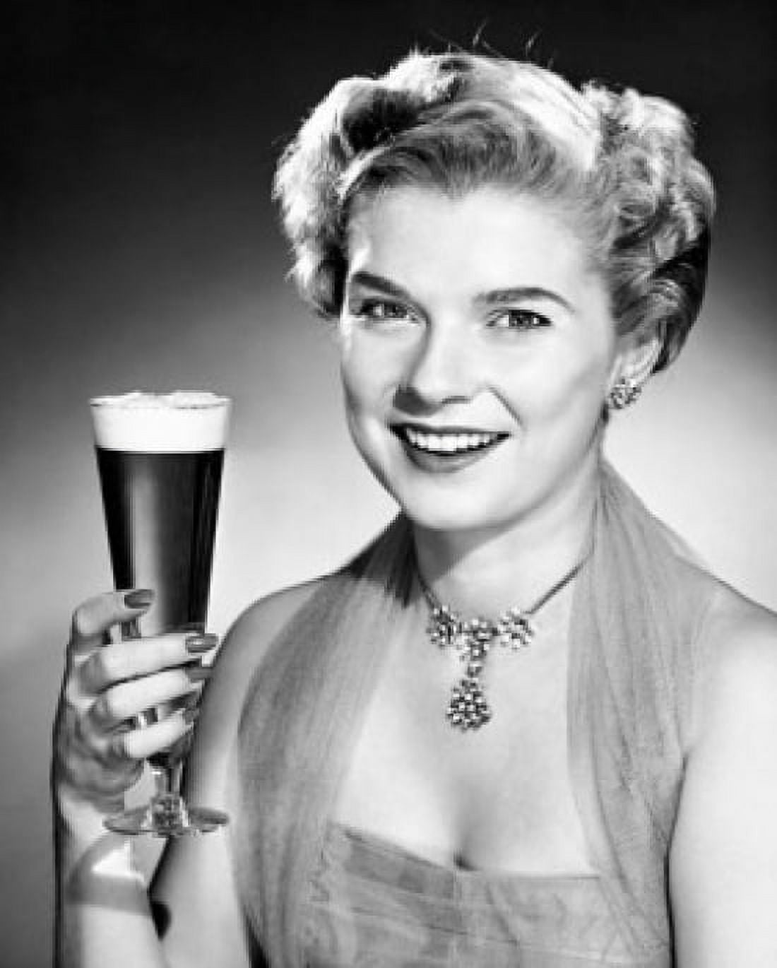 Posterazzi Portrait of a young woman holding a glass of beer Canvas Art -  (24 x 36)