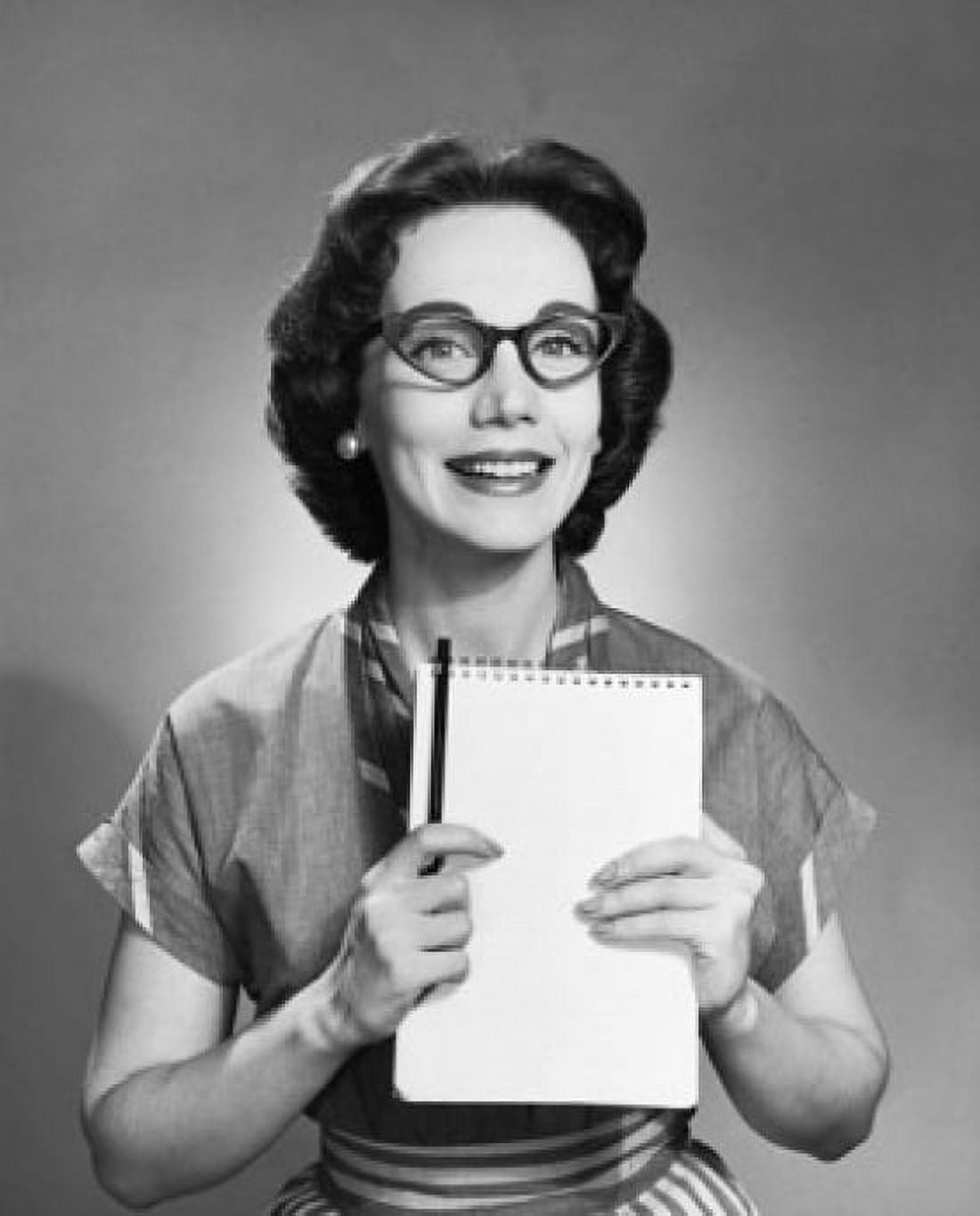 Posterazzi Portrait of a young woman holding a notepad and a pencil Canvas Art - (24 x 36)