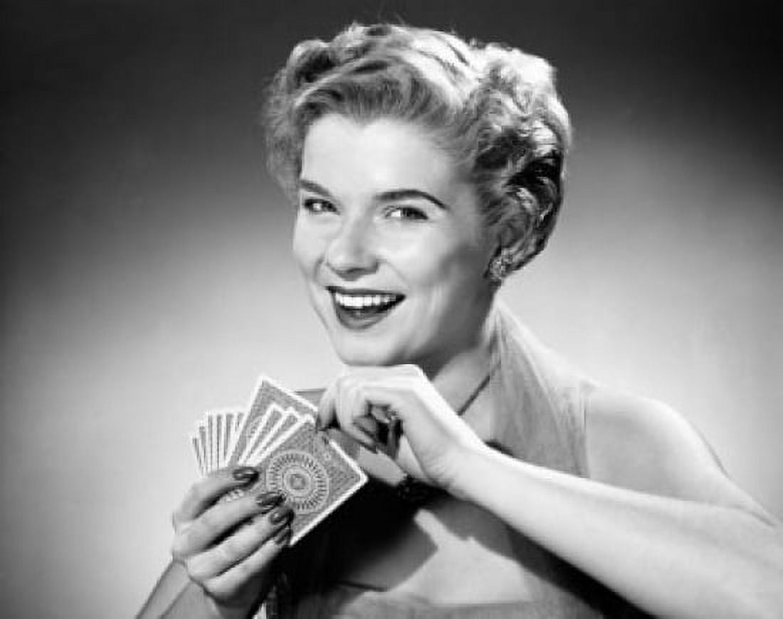 Posterazzi Portrait of a young woman holding cards and smiling Canvas Art - (24 x 36)