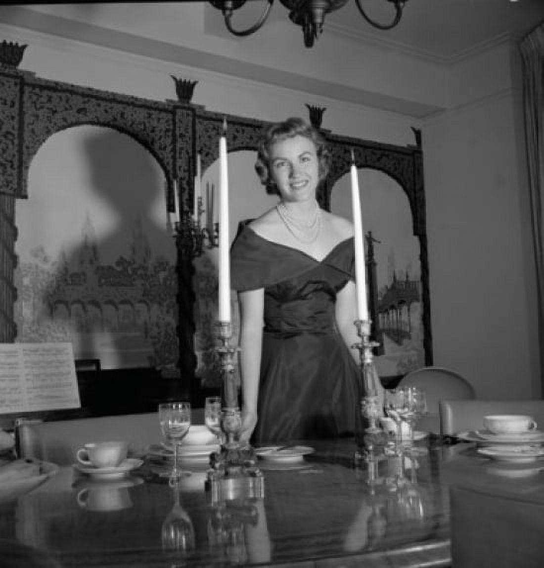 Posterazzi Portrait of a young woman standing near a dining table Canvas Art - (24 x 36)