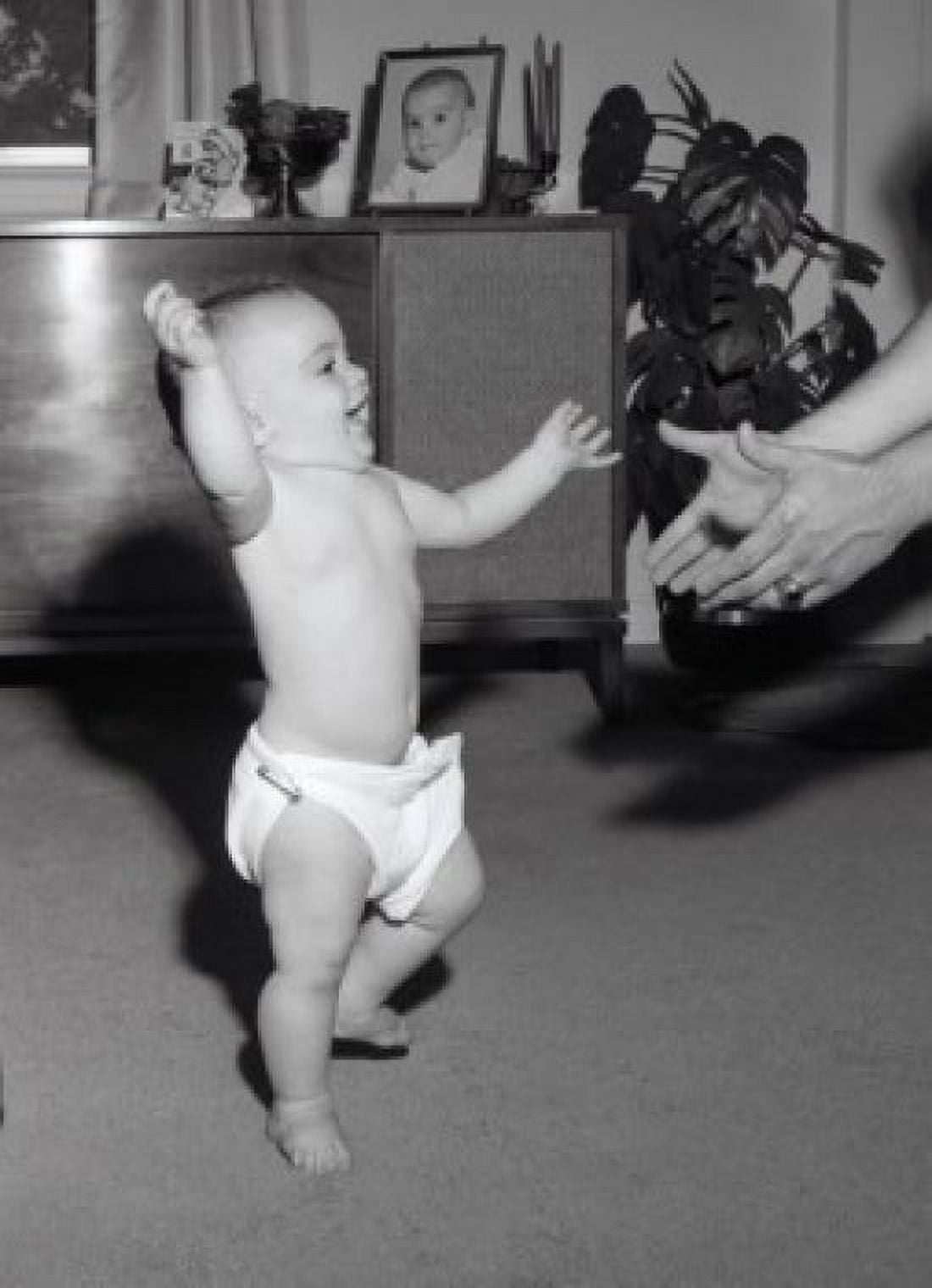 Posterazzi Portrait of baby doing first step Canvas Art - (24 x 36)