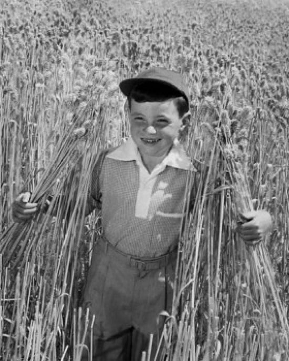 Posterazzi Portrait of boy standing in field Canvas Art -  (24 x 36)