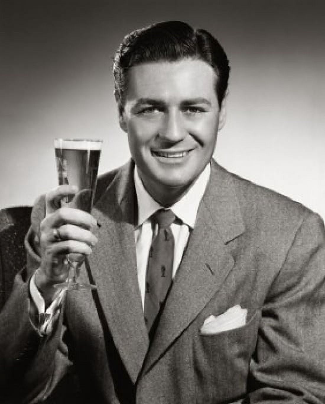 Posterazzi Portrait of mid adult man holding glass of beer Canvas Art - (24 x 36)