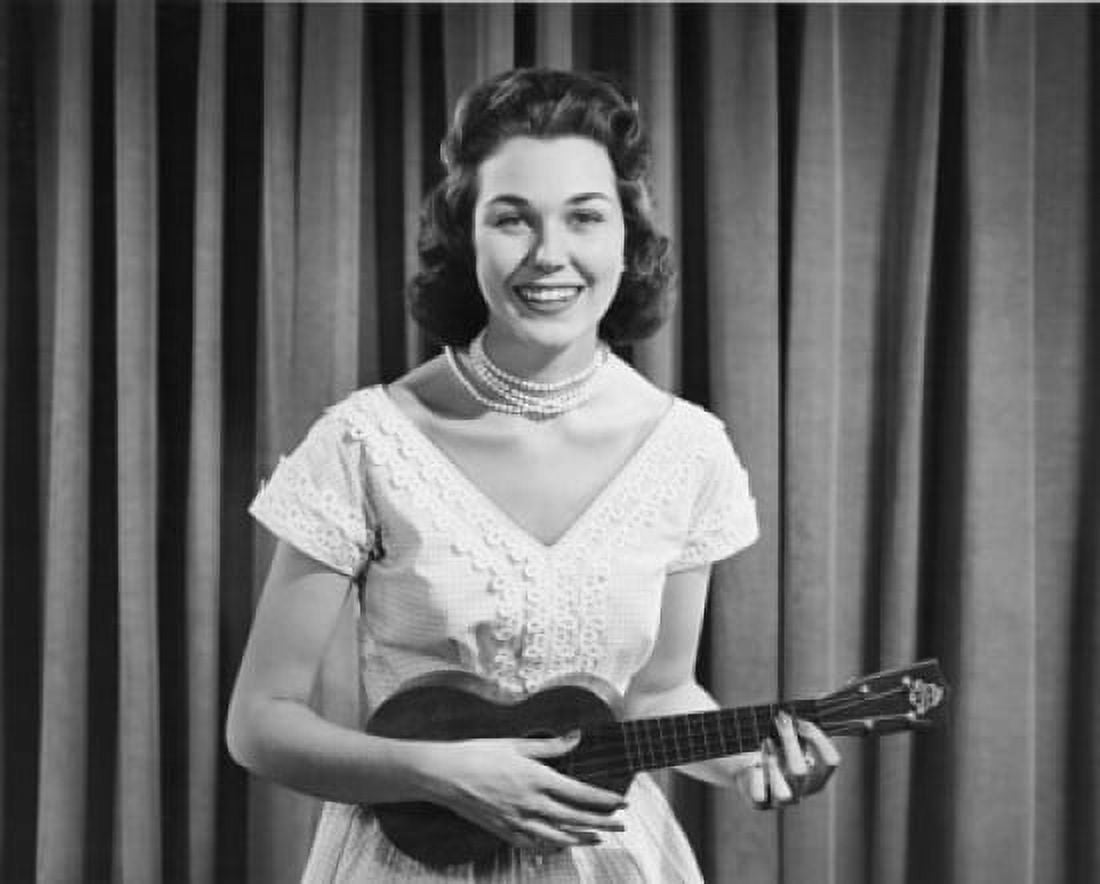 Posterazzi Portrait of young woman playing ukulele Canvas Art - (24 x 36)