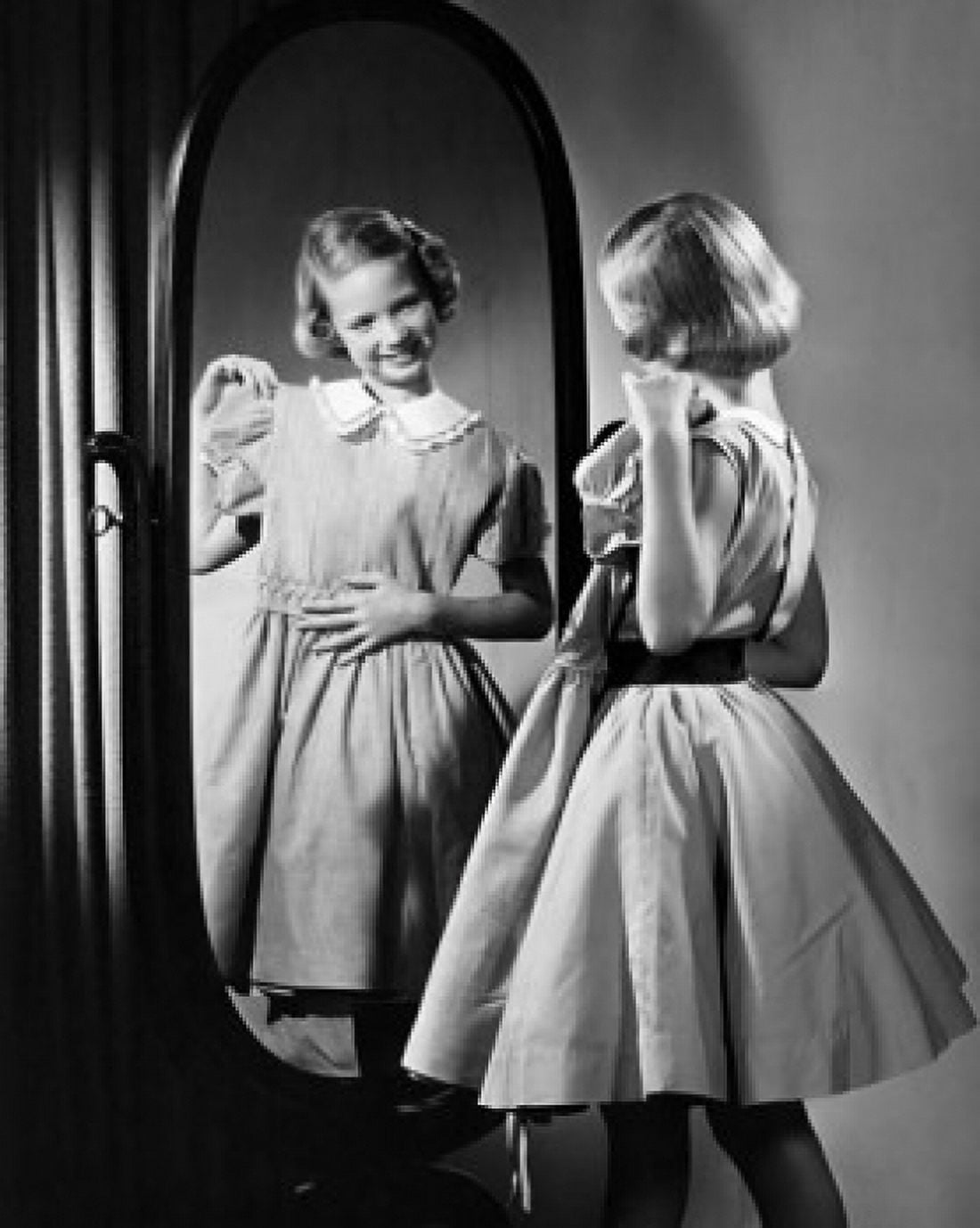 Posterazzi Rear view of a girl looking at herself in a mirror Canvas Art - (24 x 36)