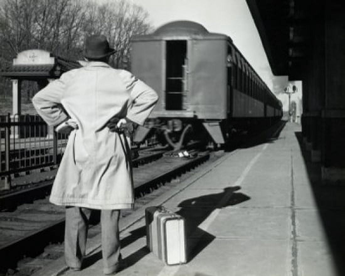 Posterazzi Rear view of a man standing at a railroad station platform Canvas Art - (24 x 36)