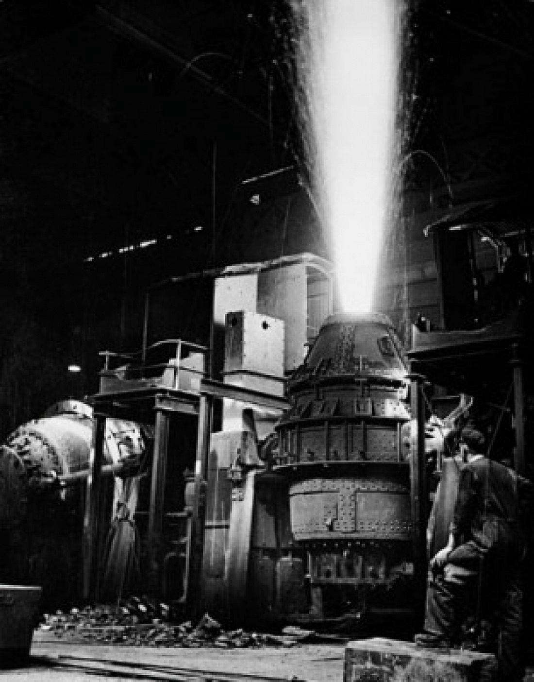 Posterazzi Rear view of a mature man looking at a Bessemer converter in a steel mill Canvas Art - (24 x 36)