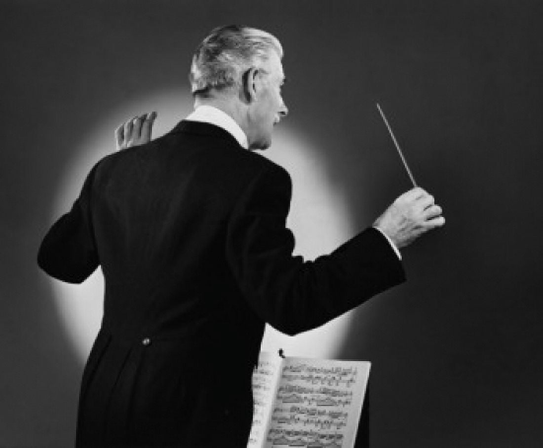 Posterazzi Rear view of a music conductor holding a conductors baton Canvas Art - (24 x 36)