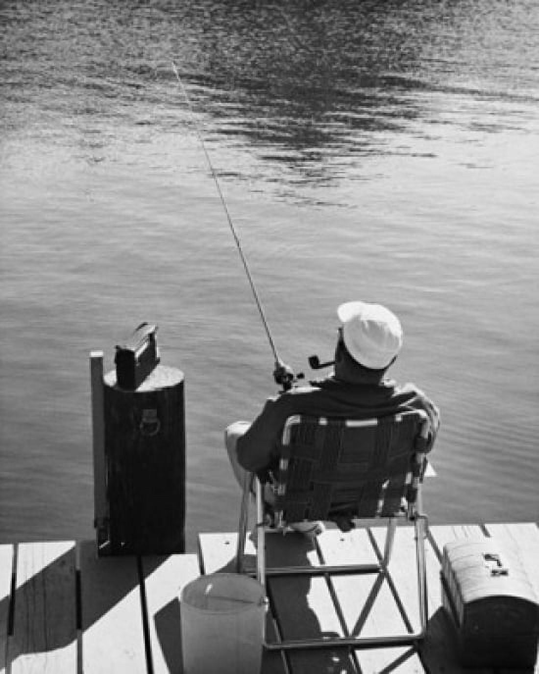 Posterazzi Rear view of man fishing Canvas Art - (24 x 36)