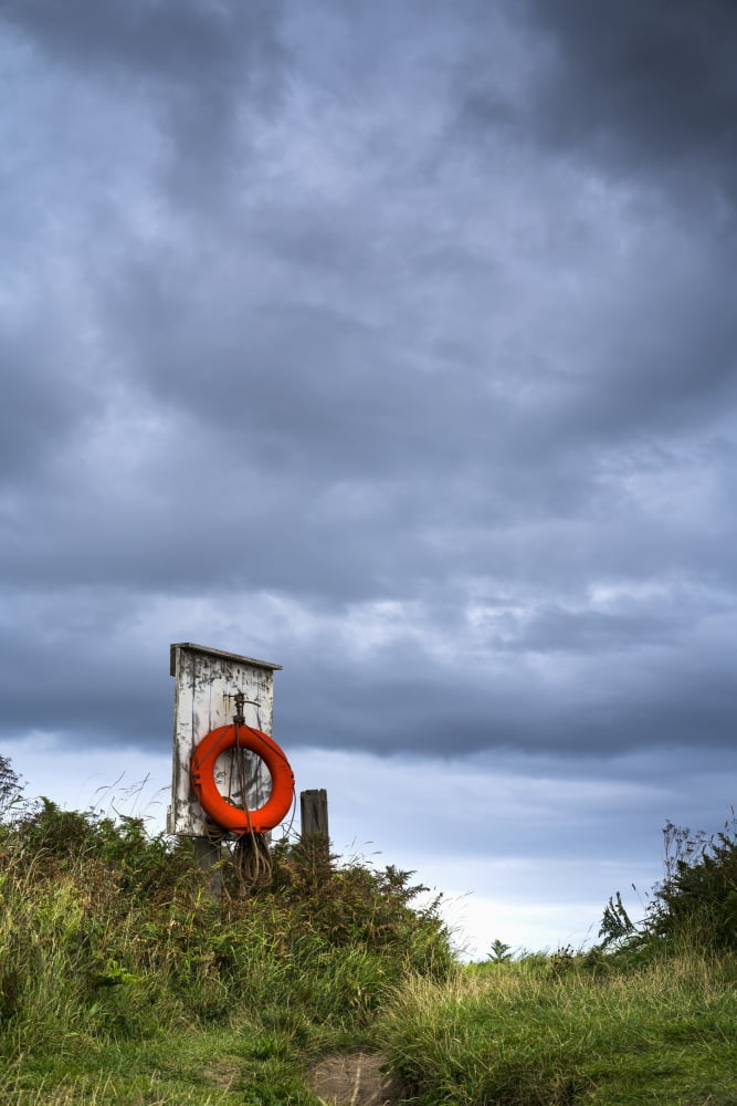 Posterazzi Red ring life preserver hanging on a wooden post Northumberland England Canvas Art - John Short Design Pics (24 x 38)