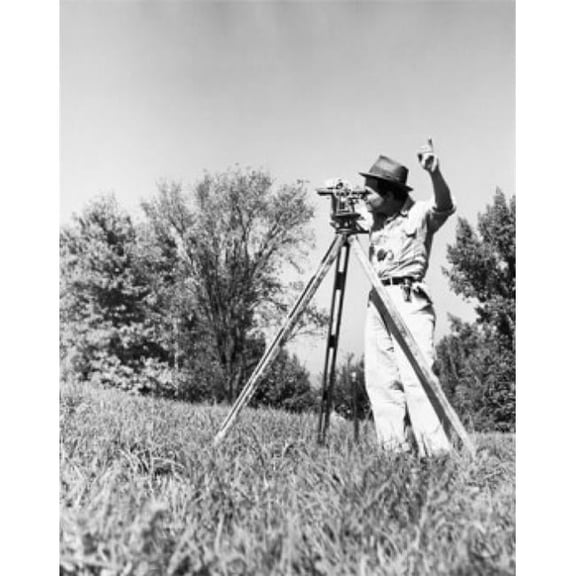 Posterazzi SAL25537129 Male Surveyor Standing in a Field & Looking Through a Theodolite Poster Print - 18 x 24 in.