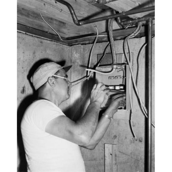 Posterazzi SAL25537346 Side Profile of an Electrician Installing a Circuit Board Poster Print - 18 x 24 in.