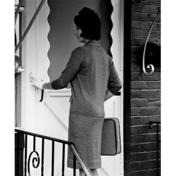 Posterazzi SAL255417820 Young Woman Standing in Front of Entrance Door Using Doorbell Poster Print - 18 x 24 in.