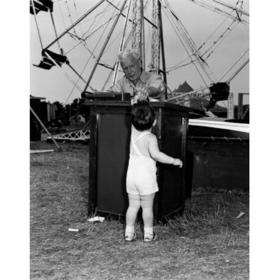 Posterazzi SAL255417960 Boy Paying for Amusement Park Ride Poster Print - 18 x 24 in.