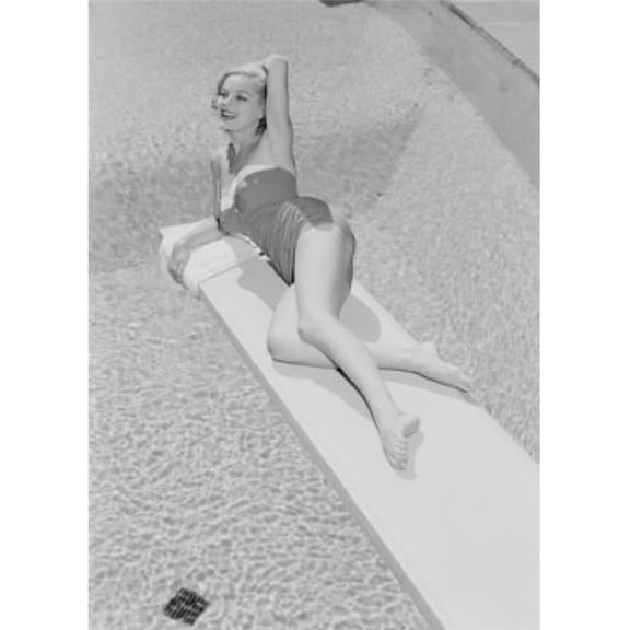 Posterazzi SAL255419030 Young Woman in Swimwear Lying on Diving Board Poster Print - 18 x 24 in.