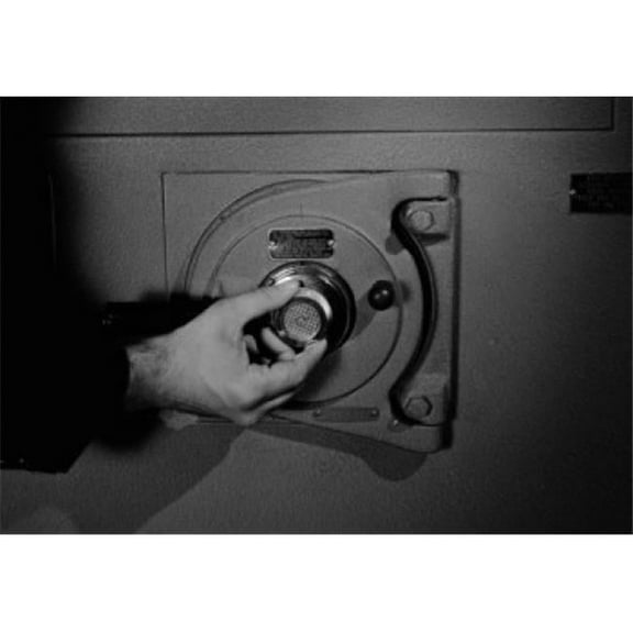 Posterazzi SAL255421407B Mans Hand Unlocking Safe Poster Print - 18 x 24 in.