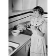 thumbnail image 1 of Posterazzi SAL255424097 Young Woman Icing Cake in Kitchen Poster Print - 18 x 24 in., 1 of 1