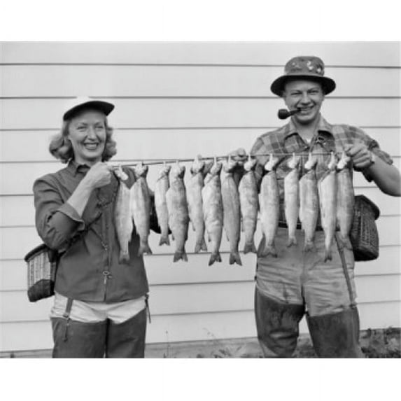 Posterazzi SAL255424456 USA Cascade Mountain Lake Woman & Man Holding Rainbow Trout Poster Print - 18 x 24 in.