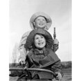 thumbnail image 1 of Posterazzi SAL255424457 Brother & Sister Wearing Rain Coats & Holding Garden Hose Poster Print - 18 x 24 in., 1 of 1