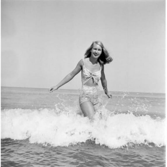Posterazzi SAL255424527 Young Woman Wearing Bikini Wading in Sea Poster Print - 18 x 24 in.