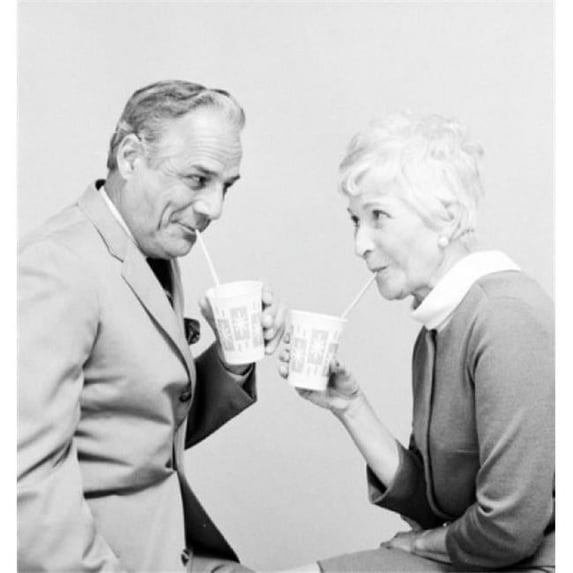 Posterazzi SAL25548860 Senior Couple Drinking & Looking Each Other Poster Print - 18 x 24 in.