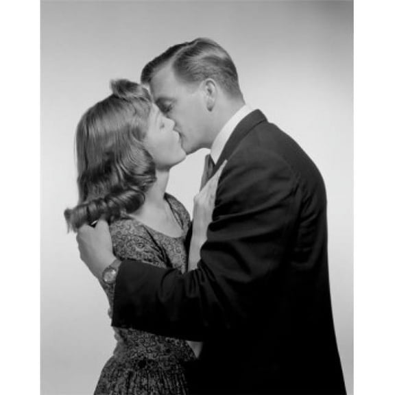 Posterazzi SAL2555588 Young Couple Kissing Studio Shot Poster Print - 18 x 24 in.