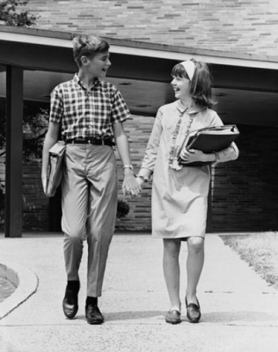 Posterazzi Schoolboy and a schoolgirl holding hands while walking Canvas Art - (24 x 36)