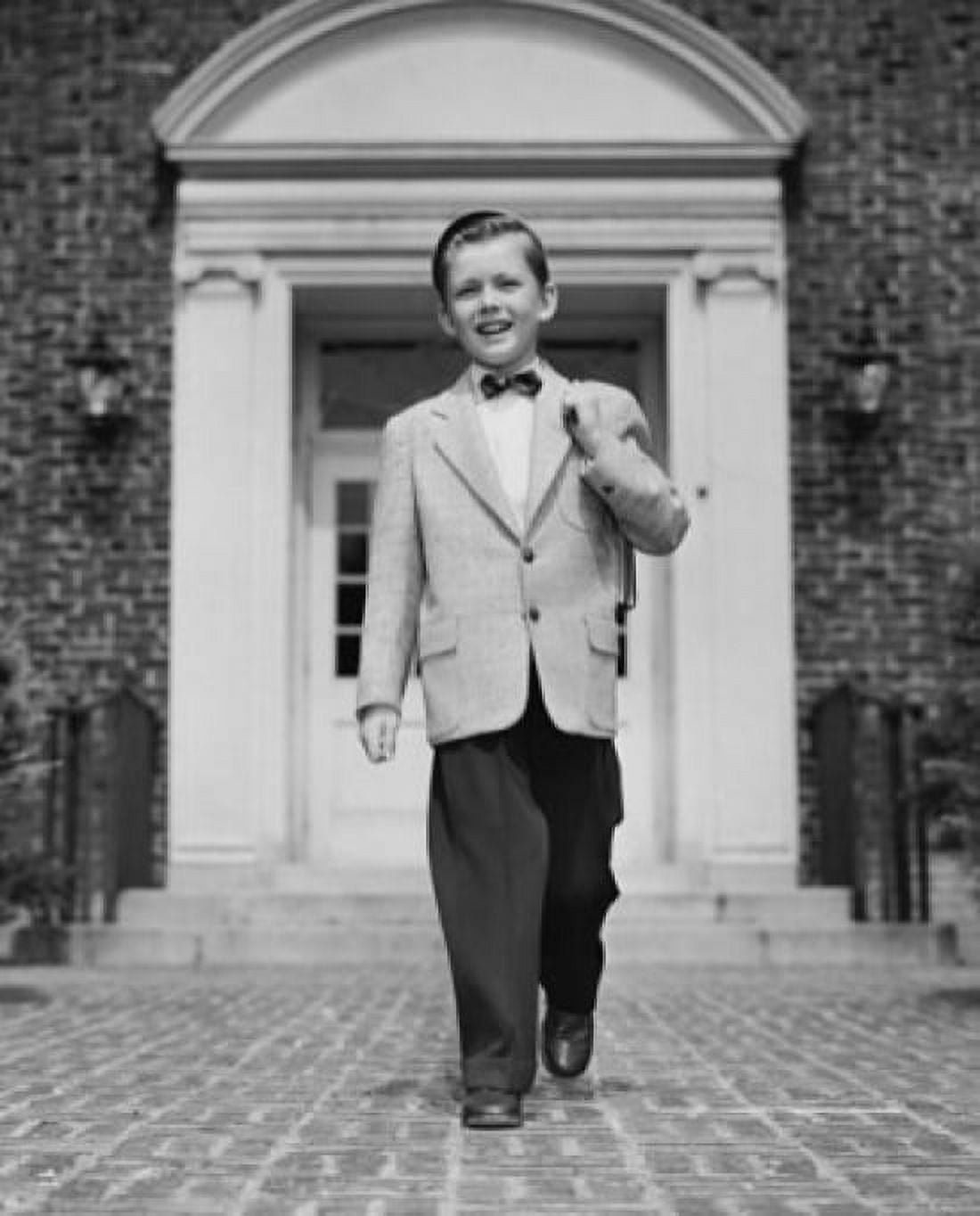 Posterazzi Schoolboy in full suit walking in front of entrance of school building Canvas Art - (24 x 36)