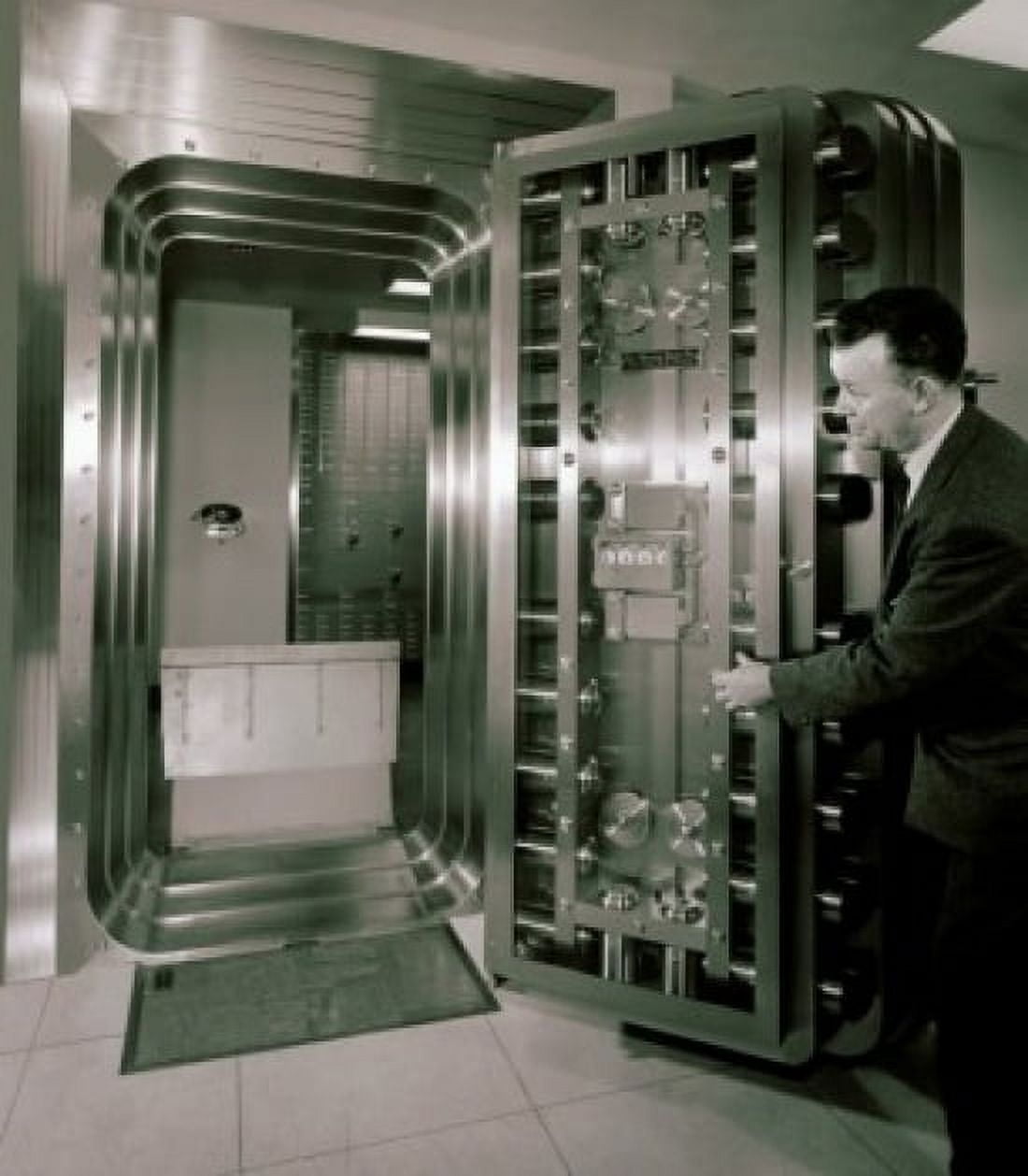 Posterazzi Side profile of a mature man opening a bank vault door Canvas Art - (24 x 36)