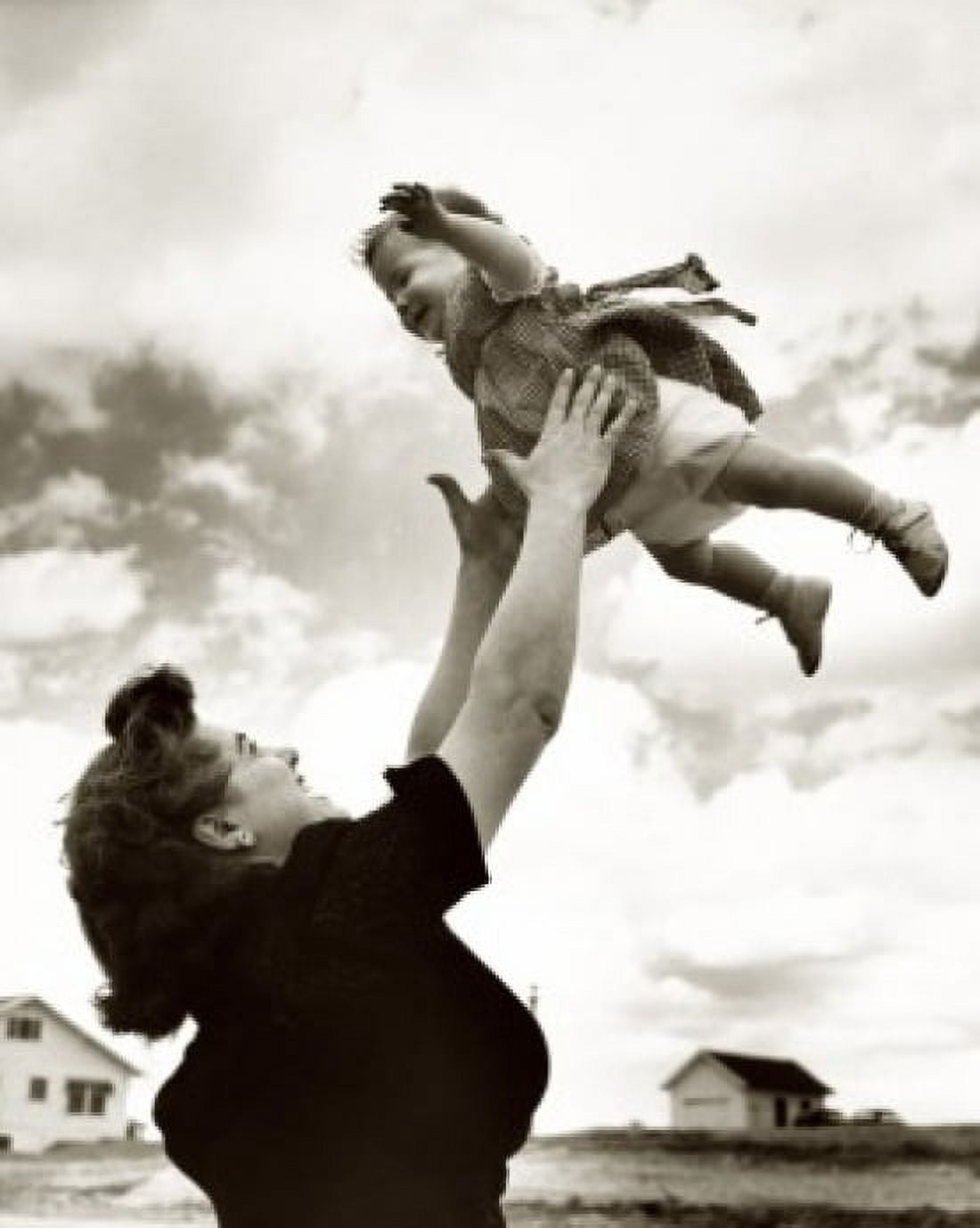 Posterazzi Side profile of a mother tossing her daughter in the air Canvas Art - (24 x 36)