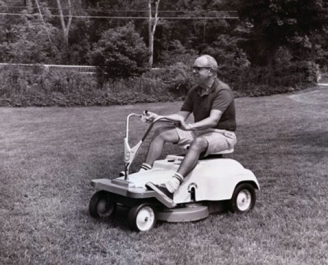 Posterazzi Side profile of a senior man riding a mower in a garden Canvas Art -  (24 x 36)