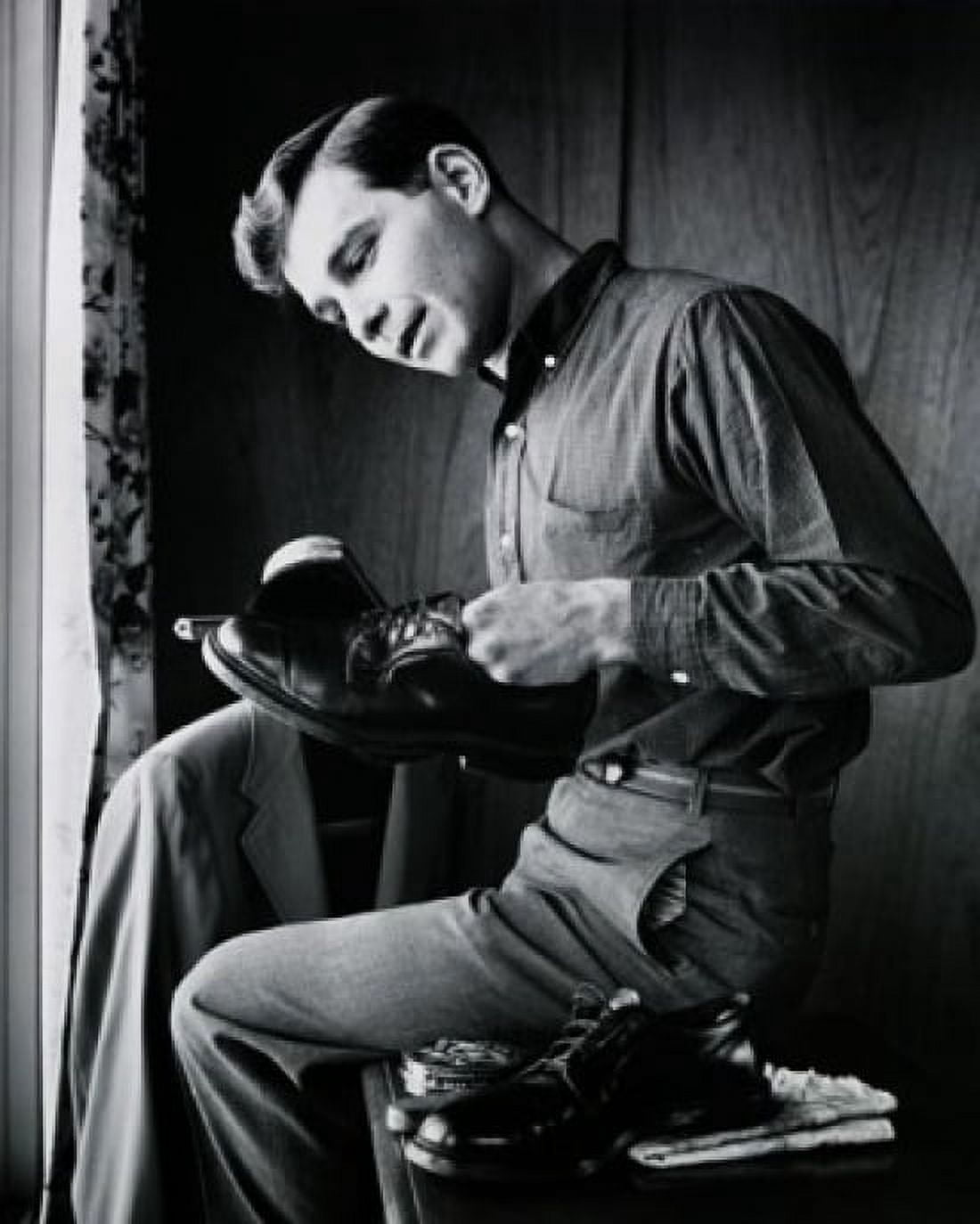 Posterazzi Side profile of a teenage boy polishing his shoes Canvas Art -  (24 x 36)