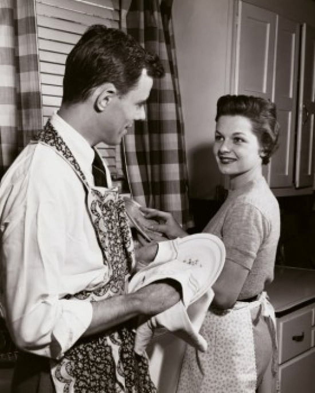Posterazzi Side profile of a young couple washing dishes in the kitchen Canvas Art - (24 x 36)