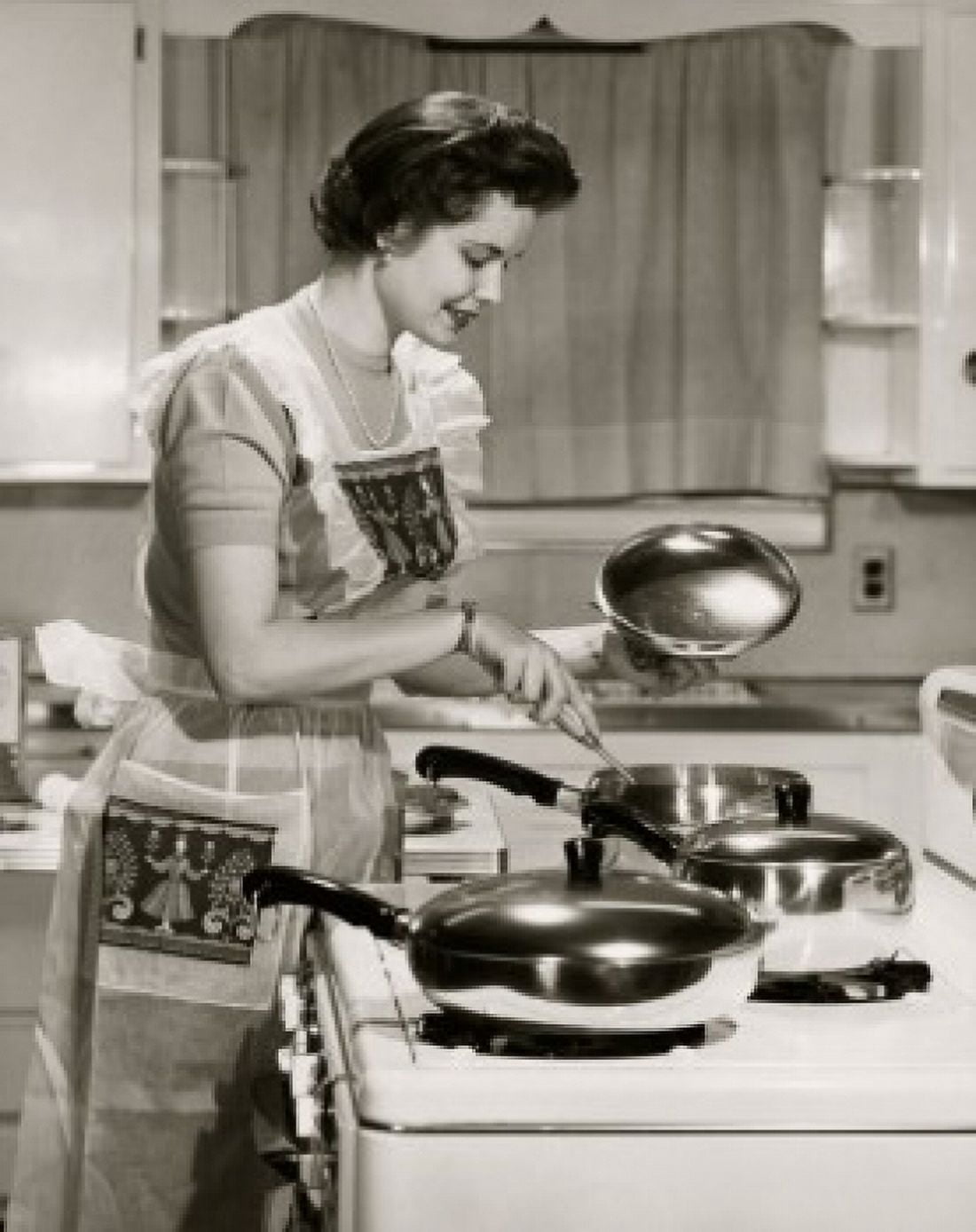 Posterazzi Side profile of a young woman cooking food in the kitchen Canvas Art - (24 x 36)
