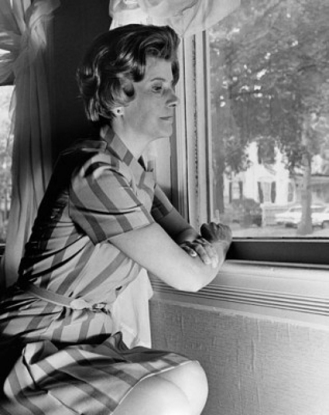 Posterazzi Side profile of a young woman looking through a window Canvas Art -  (24 x 36)