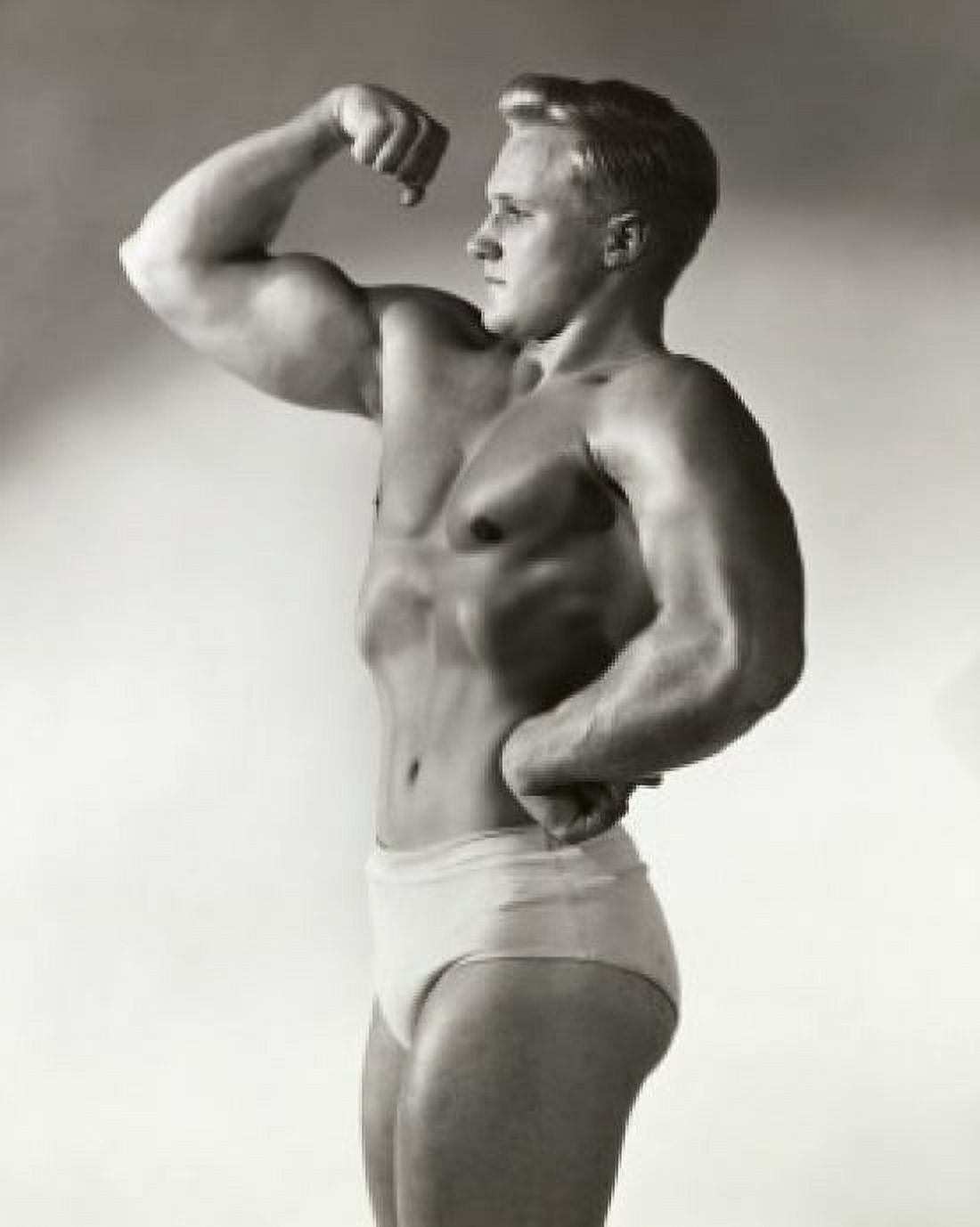 Posterazzi Side profile of young man flexing bicep Canvas Art -  (24 x 36)