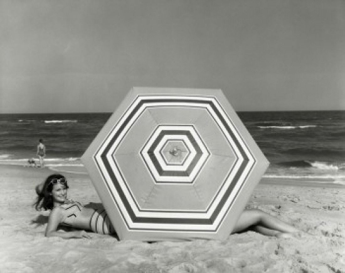 Posterazzi Side profile of young woman lying on beach Canvas Art - (24 x 36)