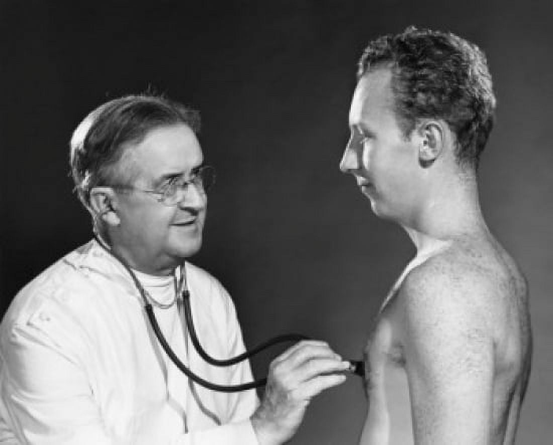 Posterazzi Side view of a male doctor examining a patient Canvas Art - (24 x 36)
