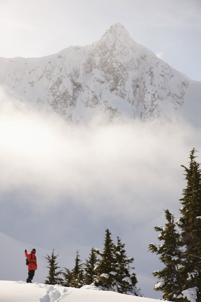 Posterazzi Snowboarder on a ridge with scenic mountains and fog in the background Haines Southeast Alaska Canvas Art - Dean Blotto Gray Design Pics (24 x 38)