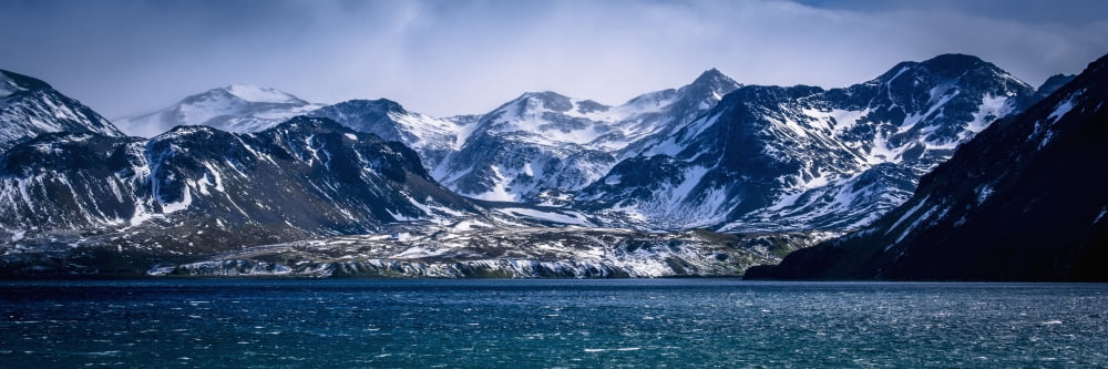 Posterazzi Snowy mountains in sunshine beside blue sea Antarctica Canvas Art - Nick Dale Design Pics (36 x 12)