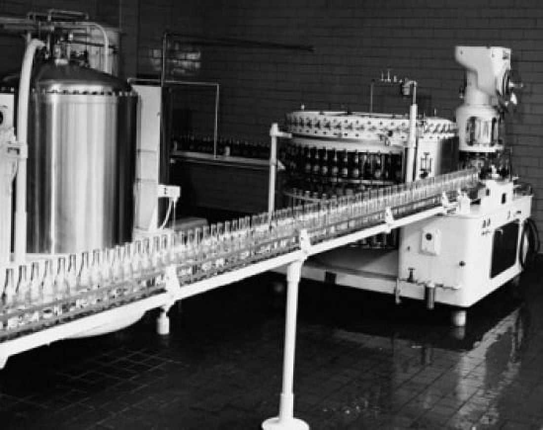 Posterazzi Soda bottle on a conveyor belt in a bottling plant Canvas Art - (24 x 36)